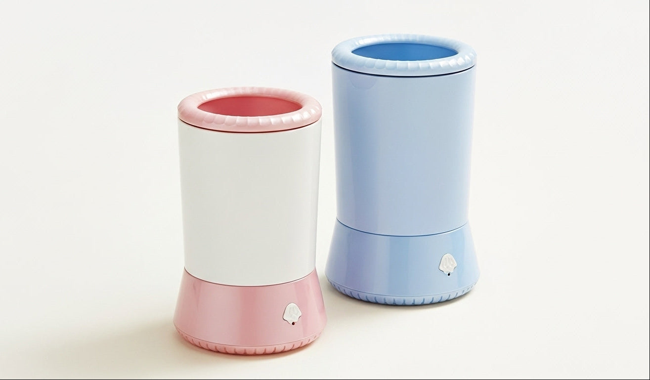Two pet paw cleaners, one pink and white, the other blue and white, on a light background.
